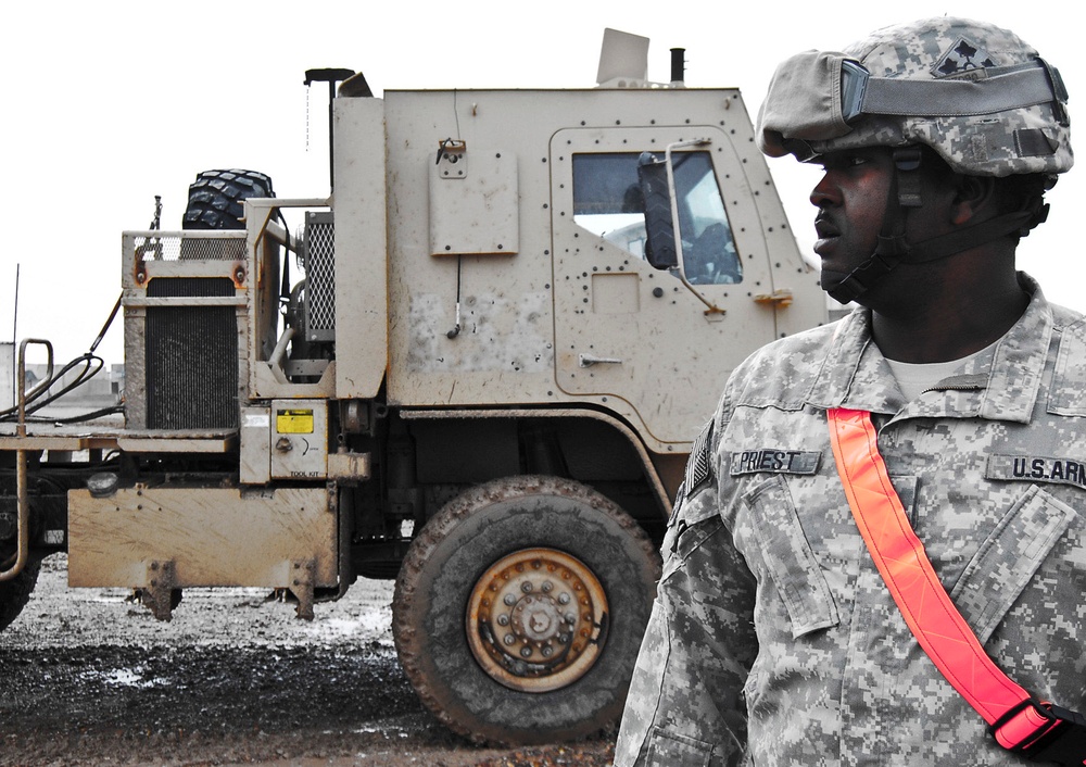 Army Sergeant Ensures Smooth Cargo Transport at Camp Taji