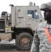 Army Sergeant Ensures Smooth Cargo Transport at Camp Taji