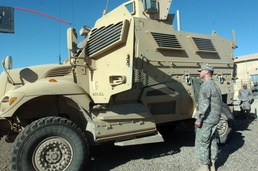 Soldier Speaks with MRAP Driver During Training in Iraq