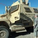 Soldier Speaks with MRAP Driver During Training in Iraq