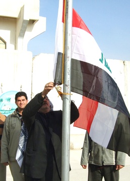 Iraqi Flag Raised Over Security Station, Marking Transition to Government Control