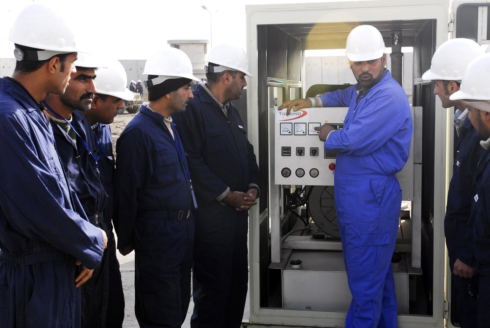 Instructor Teaches Students to Read Generator Gauges in Baghdad