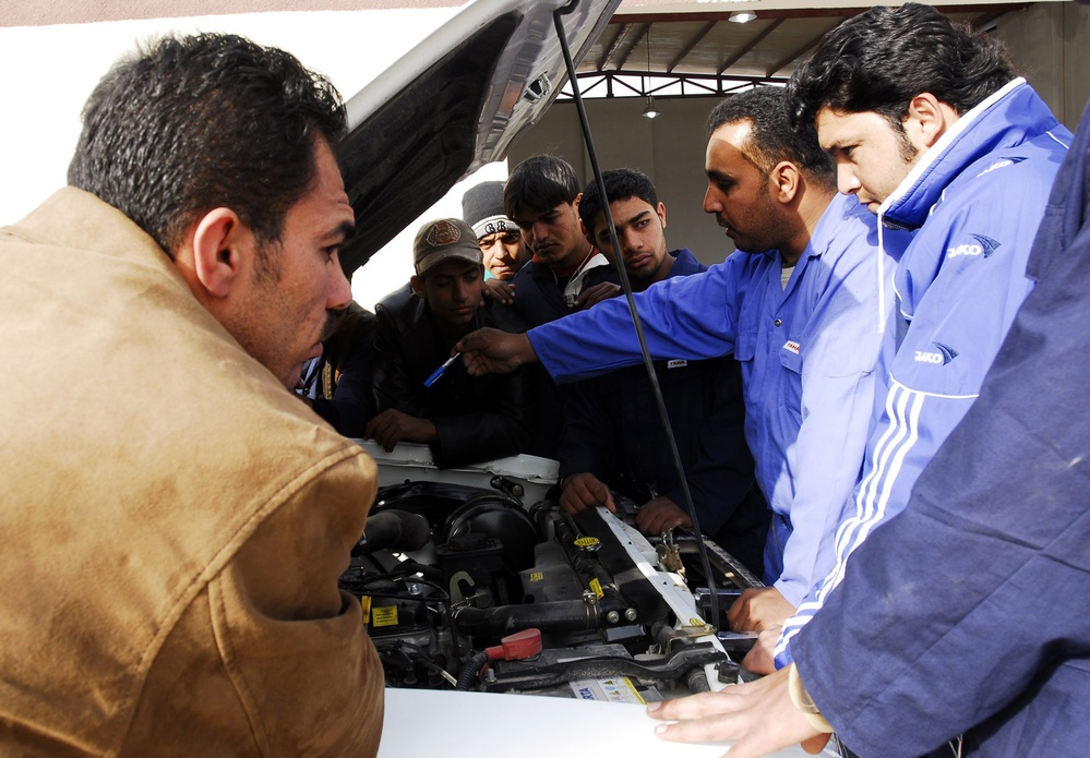 Commercial Driving Students Study Truck Engine in Baghdad