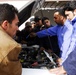 Commercial Driving Students Study Truck Engine in Baghdad