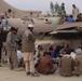 Afghan Workers Rest Near Relic of Past Conflict