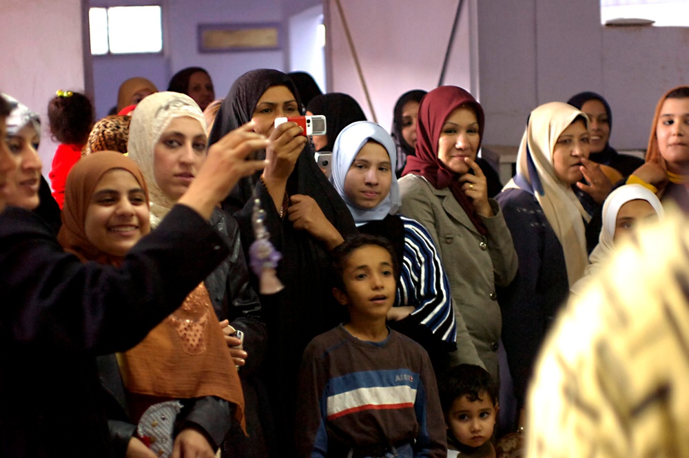 Iraqi Women Celebrate Literacy Milestone at Baghdad School