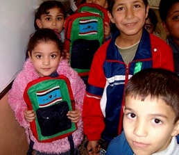 Iraqi, Coalition Forces Distribute Backpacks to Children at Nahwaran School Opening