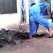 Iraqi Worker Repairs Sewer System in Baghdad's Sadr City