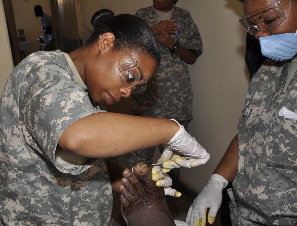 National Guard Medic Treats Infected Foot During Flintlock 09 Exercise