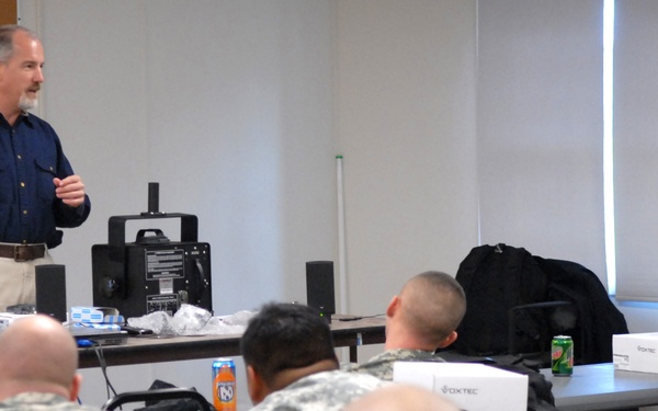 Specialist Trains Soldiers on Non-Lethal Devices at Fort Drum