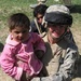 Wounded Soldier Comforts Afghan Girl During 2006 Tour