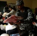 Iraqi Police Officer Distributes School Supplies to Children in Baghdad