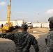 U.S. Soldiers Oversee Iraqi Contractors Moving Armored Housing Units in Baghdad