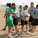 U.S. Soldier Embraces Iraqi Counterpart After Soccer Match in Southern Iraq