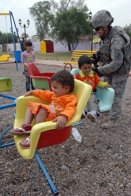 U.S. Soldier Brings Joy to Iraqi Children at Park Opening