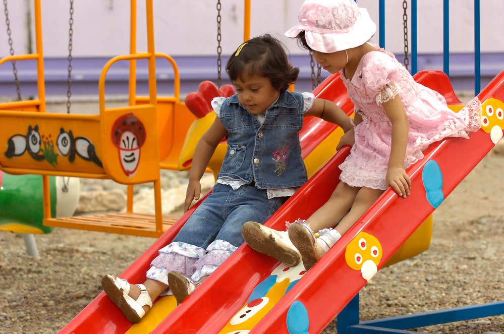 Girls Enjoy New Playground at Dover Park Opening in Baghdad