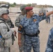 Iraqi Police Officer Explains Security Layout to U.S. Army Lieutenant in Basra