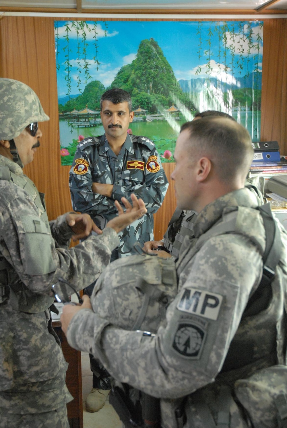 U.S. Army Officer Discusses Logistics with Iraqi Police in Basra