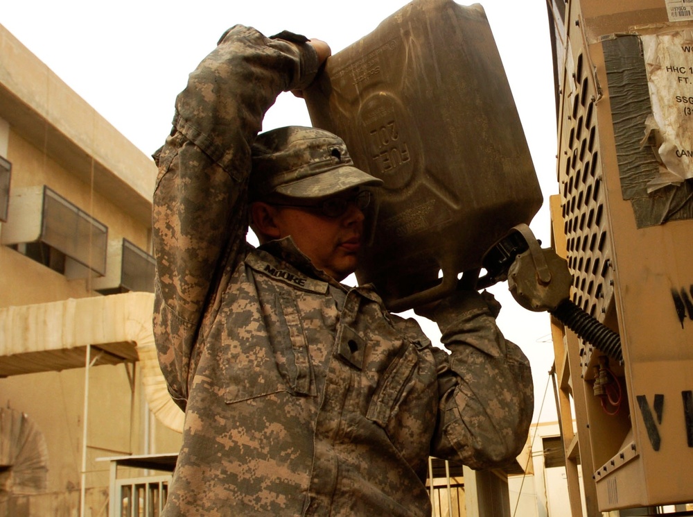 Army Specialist Maintains Power Supply at Camp Victory, Iraq