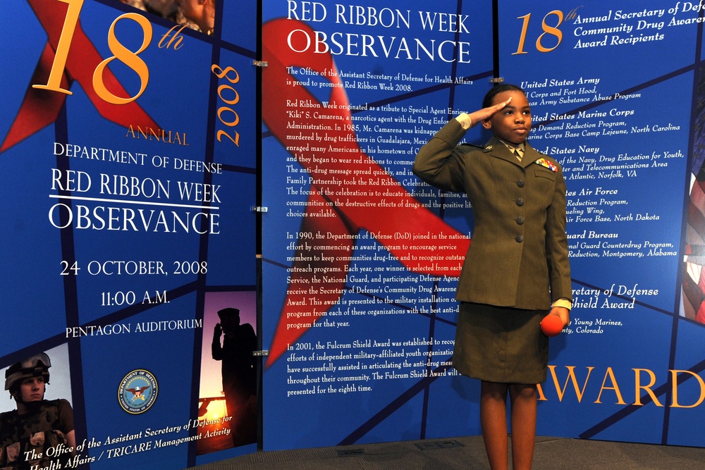 Marine Lance Cpl. Salutes After Giving Anti-Drug Speech at Pentagon Ceremony