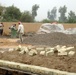 Workers Establish Perimeter of New Building in Taji, Iraq