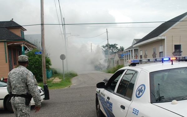 Louisiana National Guard, NOPD Respond to Vehicle Fire in New Orleans' Lower 9th Ward