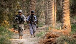 U.S. Soldier Patrols with Iraqi Police in Diwaniya
