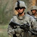 U.S. Army Sergeant Leads Iraqi Soldier on Patrol in Date Palm Grove