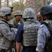 U.S. Soldier Accepts Gift of Dates from Iraqi Farmer During Joint Patrol