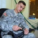 Army Clerk Maintains Rifle at Camp Taji in Iraq