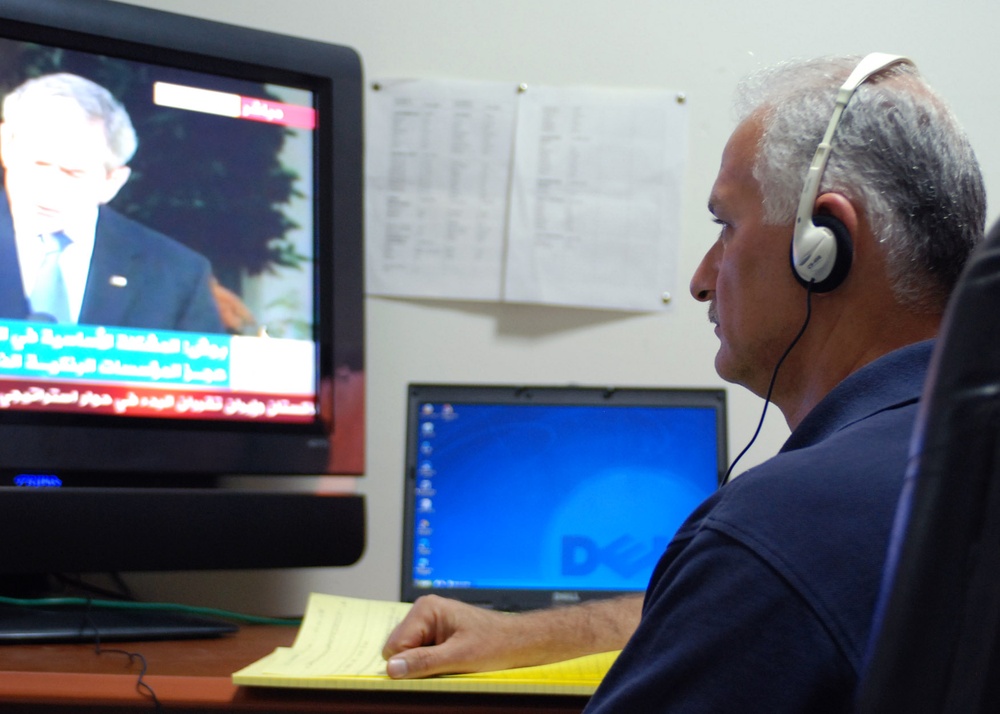 Civilian Linguist Monitors Arabic News for Coalition Forces in Iraq