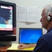 Civilian Linguist Monitors Arabic News for Coalition Forces in Iraq