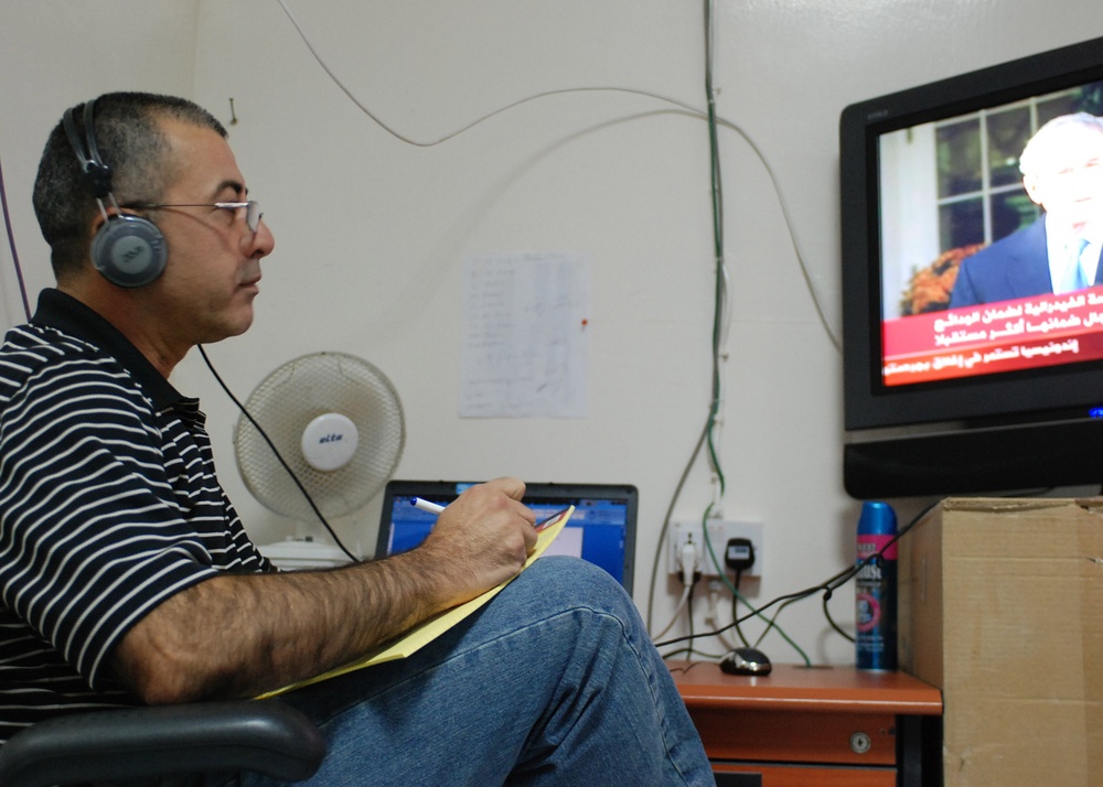 Linguist Monitors Arabic News for Coalition Forces in Iraq