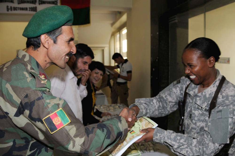 Navy Chief Petty Officer Helps Afghan Army Medical Corps Member Register for Leadership Seminar