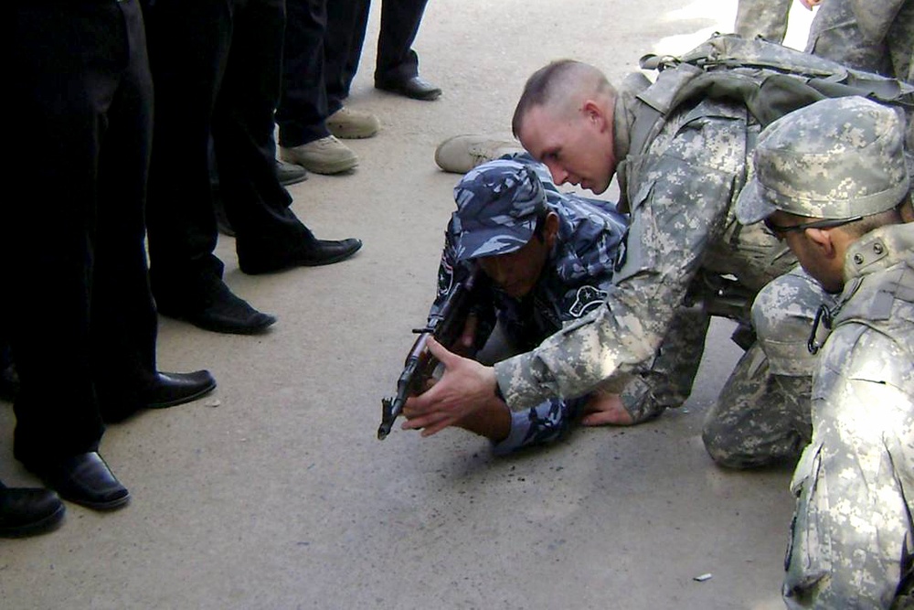 U.S. Soldier Trains Iraqi Police Officer in Baghdad
