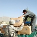 U.S. Troops and Afghan Police Distribute Donated Supplies to Local School