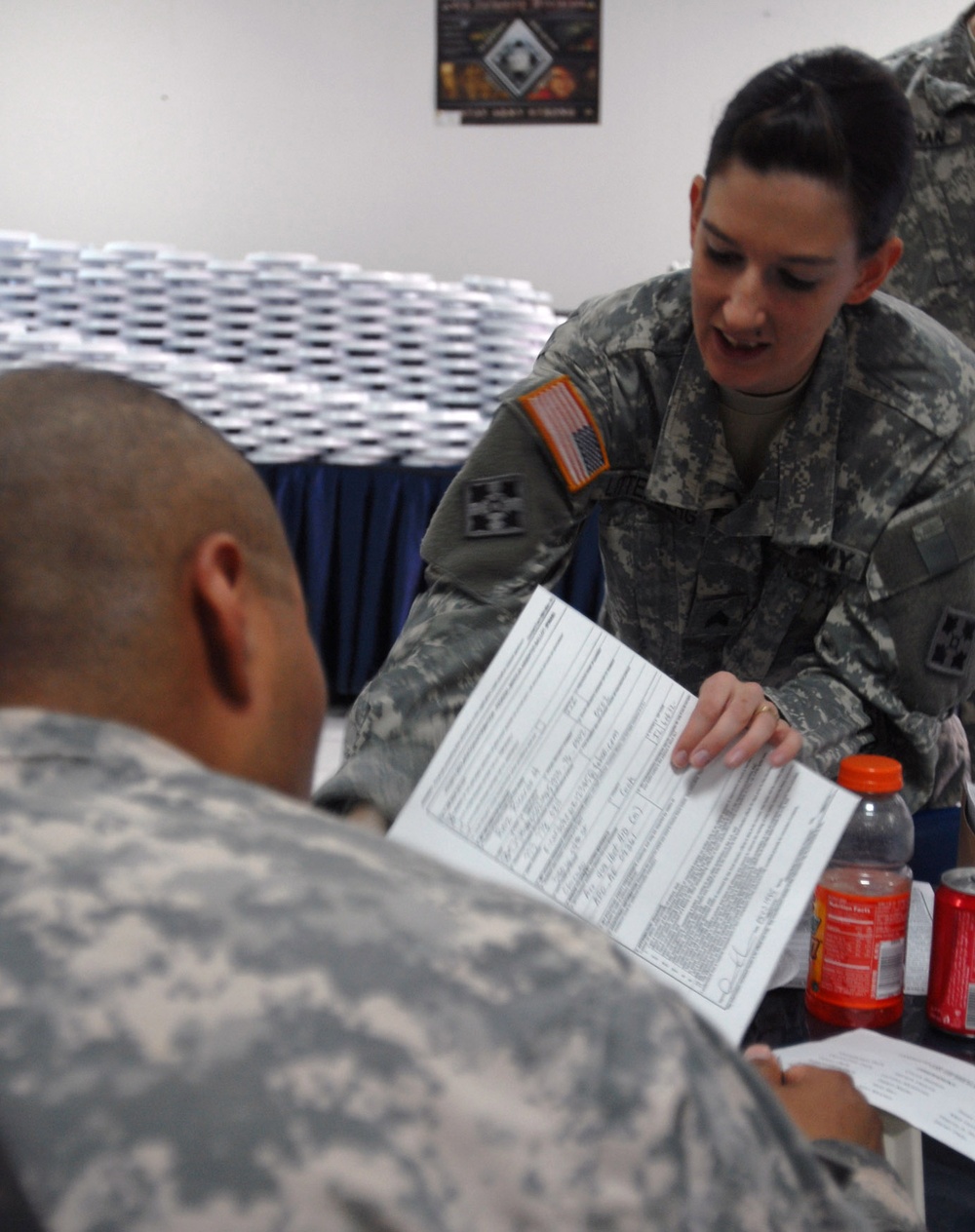 Army Paralegal Assists Soldier with Voter Registration in Iraq