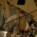 Airman Secures Army Excavator for Air Transport
