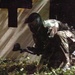 Soldier Ducks for Cover During Paintball Competition in Vicenza