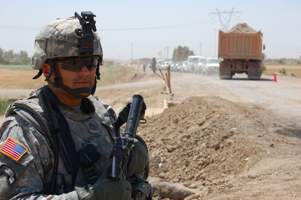 Army Sergeant Oversees Vehicle Inspections Near Baghdad