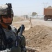 Army Sergeant Oversees Vehicle Inspections Near Baghdad