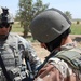 U.S. Soldier Discusses Deterrence Tactics with Iraqi Counterpart