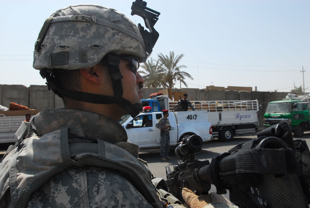 U.S. Soldier Provides Security for Iraqis Returning Home in Baghdad
