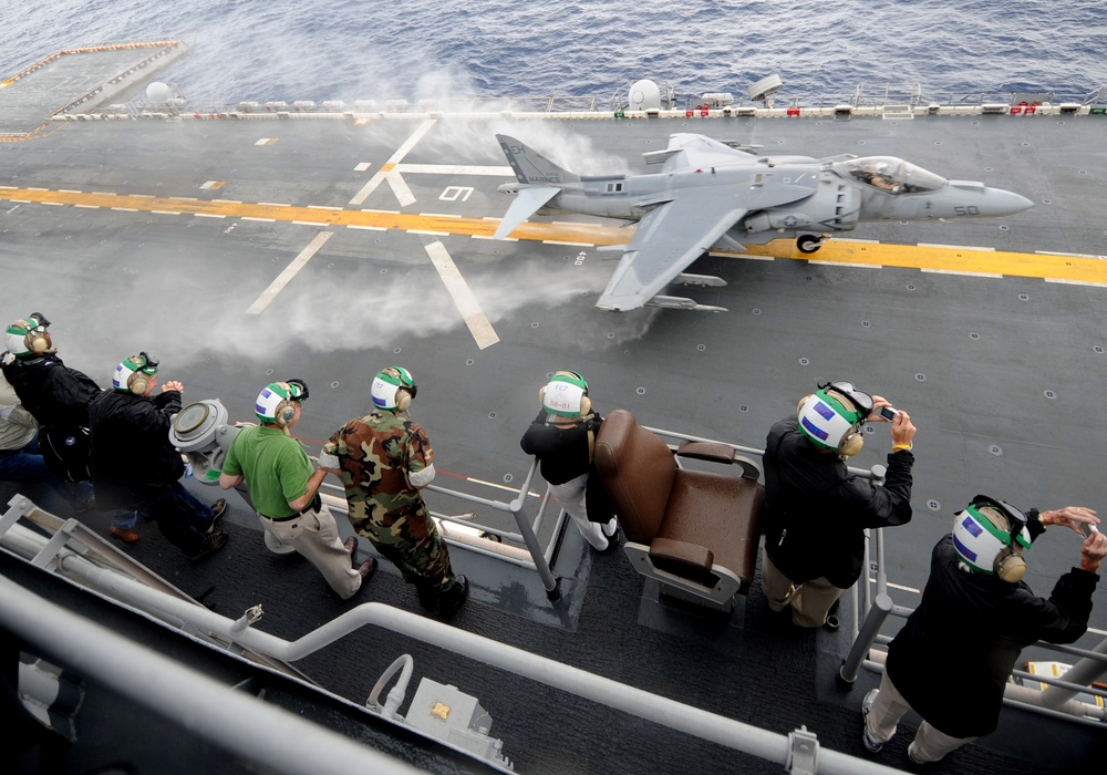 Participants Observe Marine Corps Harrier Aircraft Demonstrations Aboard USS Iwo Jima
