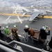Participants Observe Marine Corps Harrier Aircraft Demonstrations Aboard USS Iwo Jima