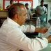 Sons of Iraq Leader Reviews Documents During Registration