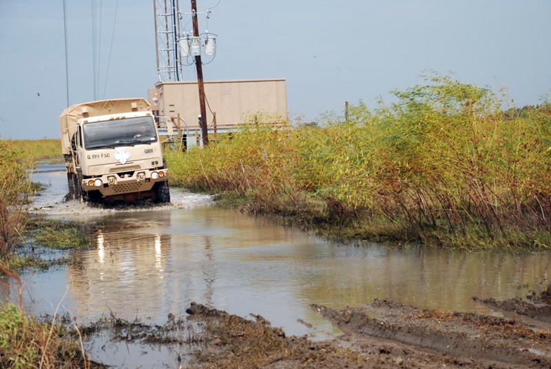 Louisiana National Guard Soldier Navigates Flooded Road to Protect Highway