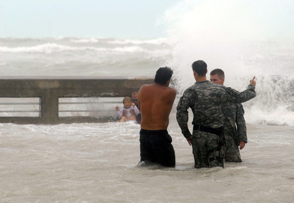 Guardsmen Warn Swimmers of Dangerous Conditions as Hurricane Ike Floods Key West Pier
