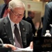 Defense Secretary Gates Reviews Notes at Defense Ministers Conference