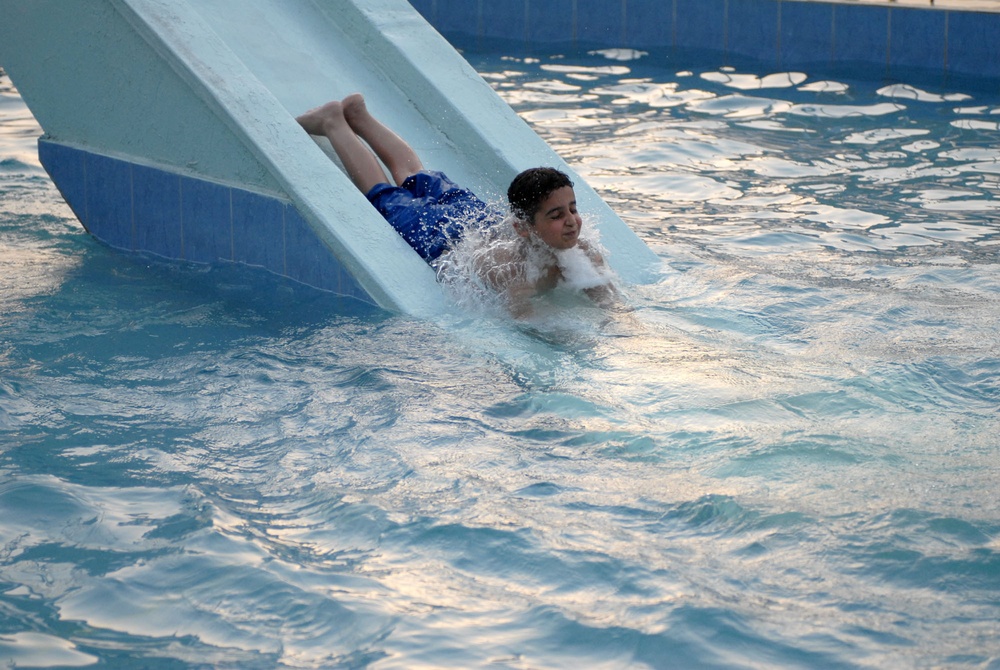 Iraqi Boy Enjoys Reopened Pool Complex in Northern Baghdad